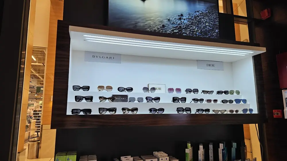 A wall of sunglasses at Lunettes